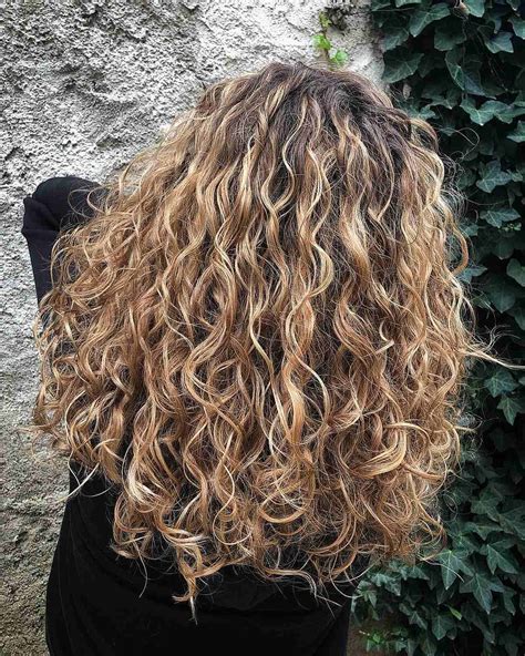 blonde highlights on curly hair|curly hair balayage blonde.